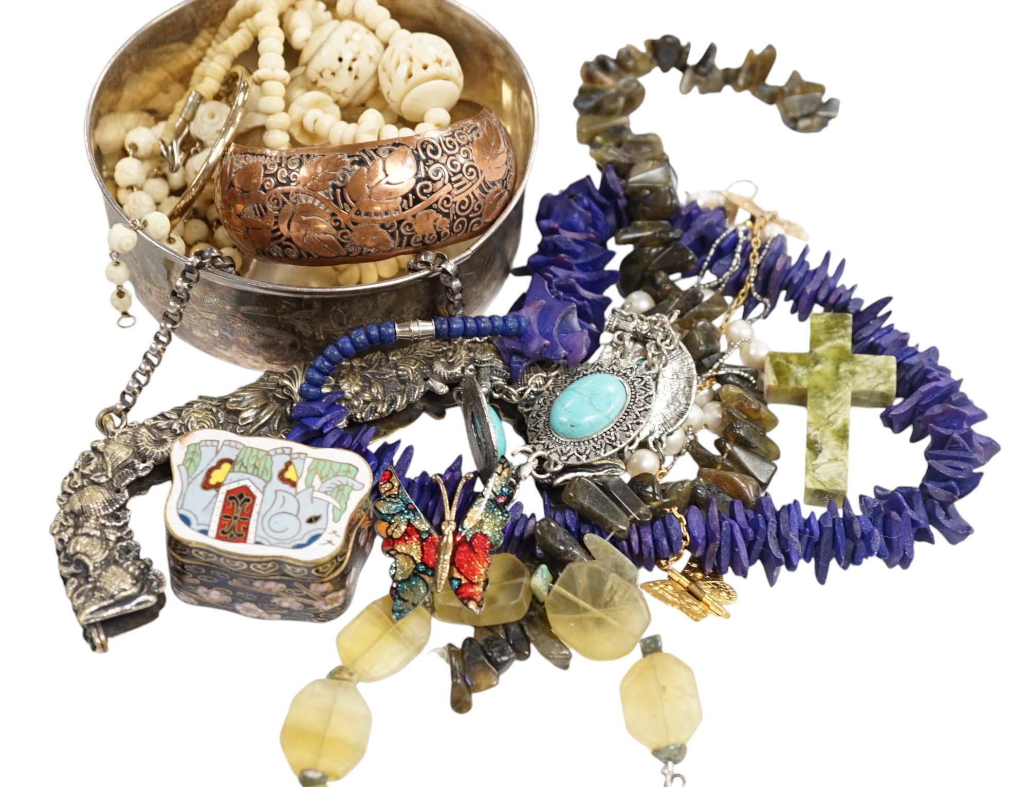 A small quantity of assorted items including bone necklaces, costume jewellery, enamelled box, coins, etc. Condition - poor to fair